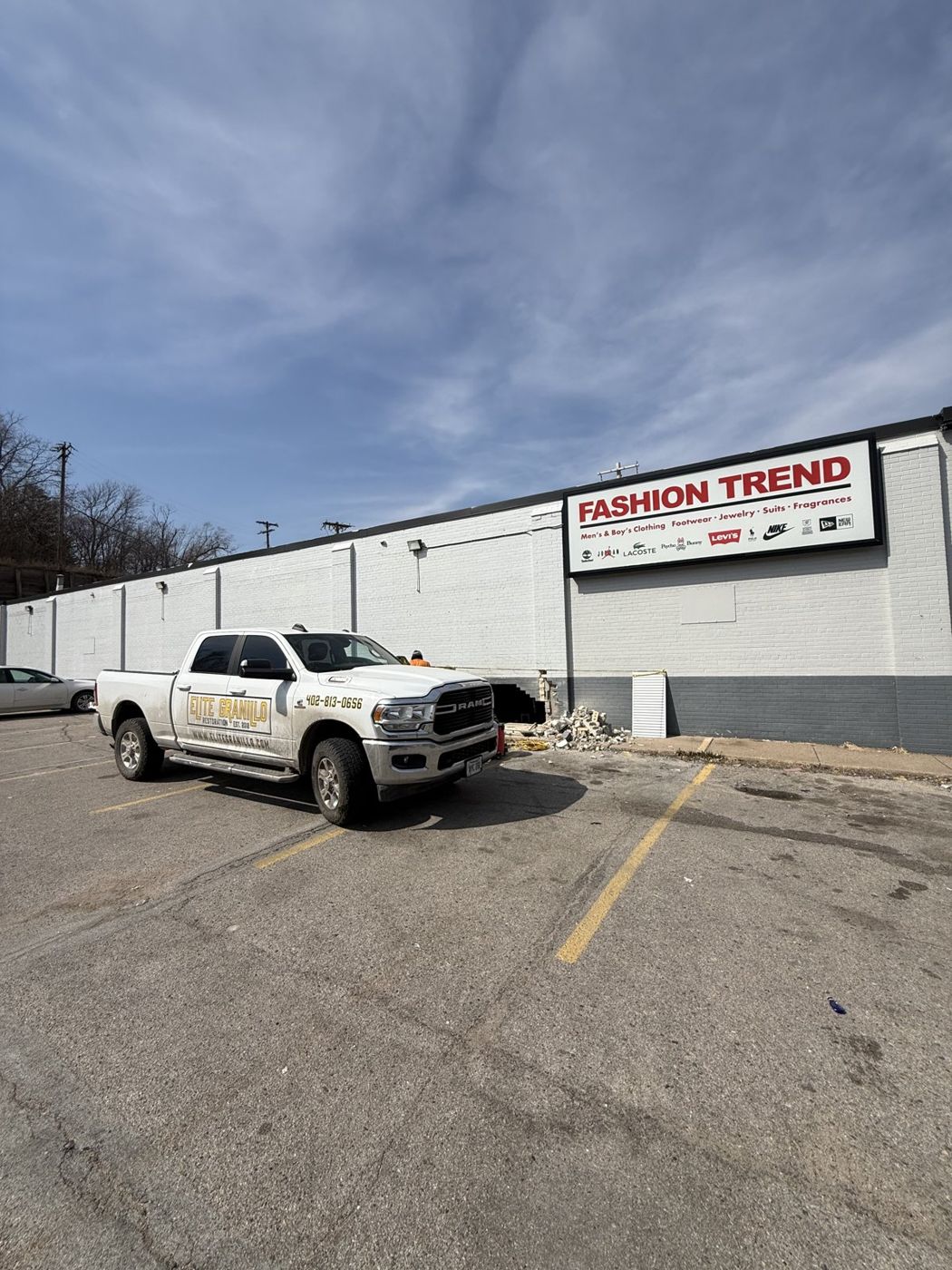 Concrete and exterior work at a commercial storefront in the Omaha area