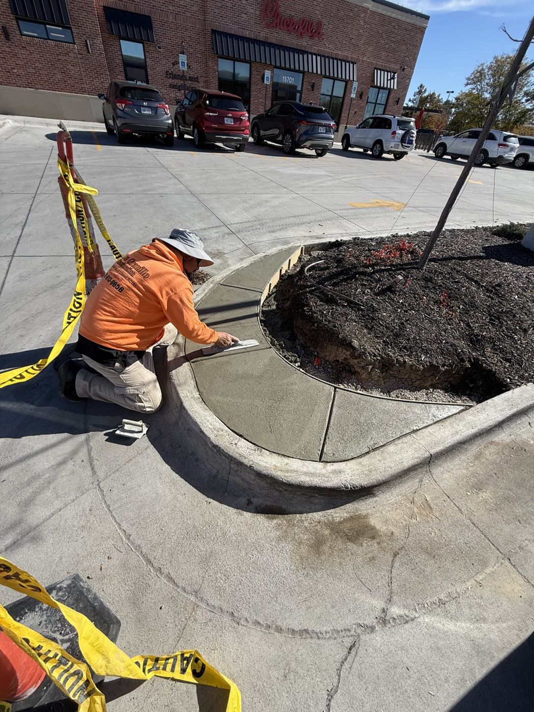 Concrete curb and island restoration in progress at an Omaha-area shopping center
