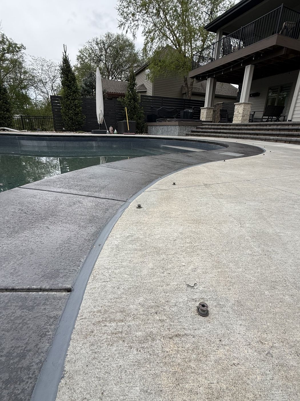 Restored concrete pool deck at a residential property near Omaha