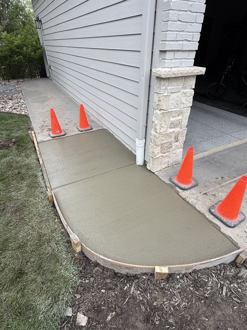 New concrete pad poured beside a home in the Omaha area