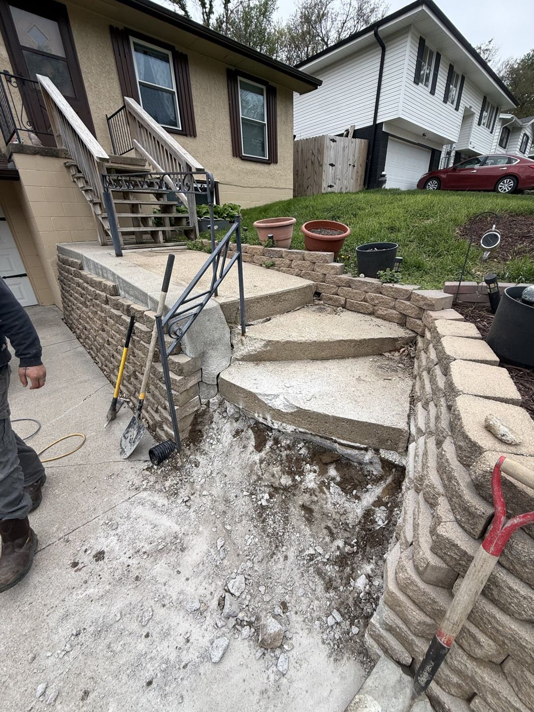 Stone retaining wall and concrete steps repair at an Omaha-area home